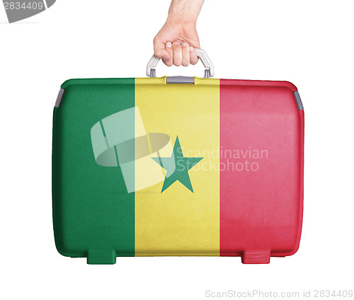 Image of Used plastic suitcase with stains and scratches