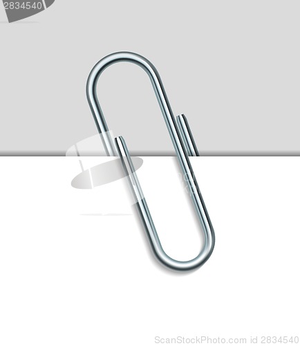 Image of Metal paperclip and paper