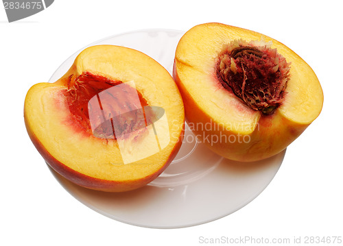 Image of Sliced peach on the plate, isolated 