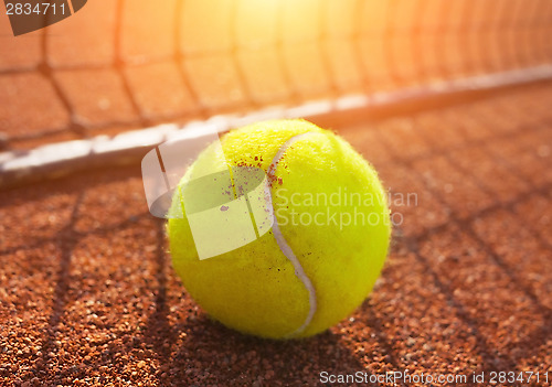 Image of tennis ball on a tennis court