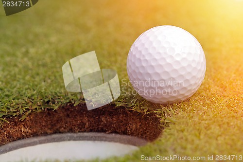 Image of Golfball almost in the hole 
