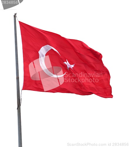 Image of Turkish flag on flagpole waving in wind