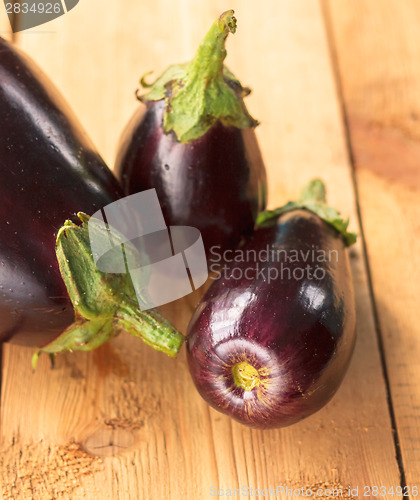 Image of Eggplants On A Wooden Background