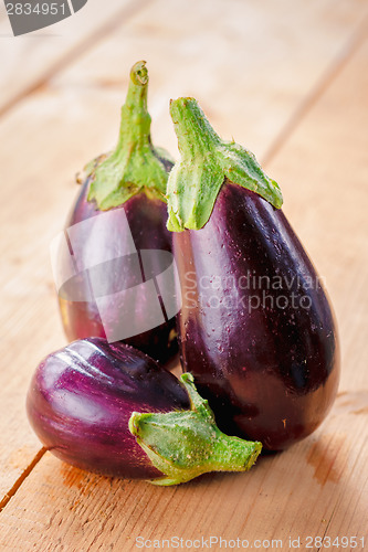 Image of Eggplants On A Wooden Background