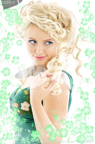 Image of lady in emerald dress with flowers