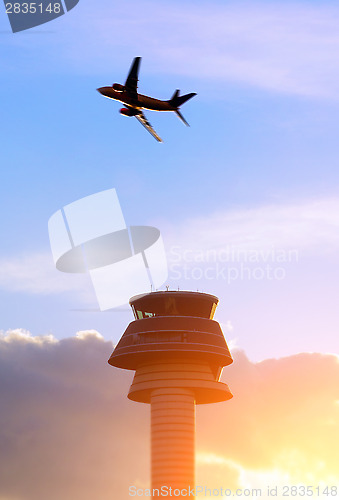 Image of Airport control tower, passenger airplane 