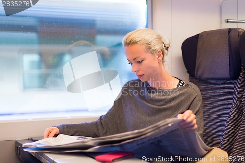 Image of Lady traveling by train.