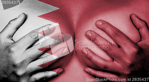 Image of Hands covering breasts