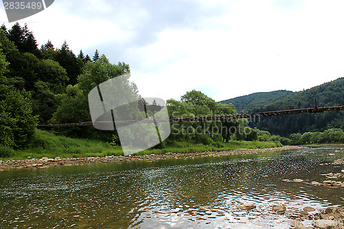 Image of nice bridge across the speed mountainous river