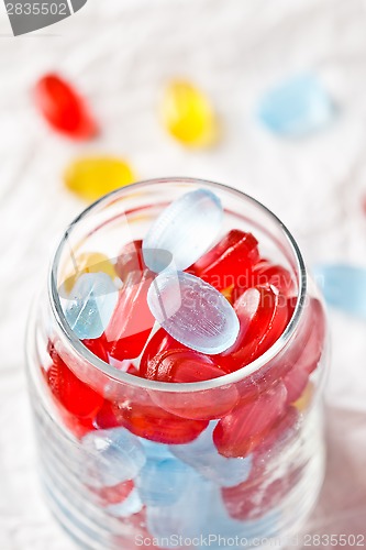 Image of colorful candies in glass jar 