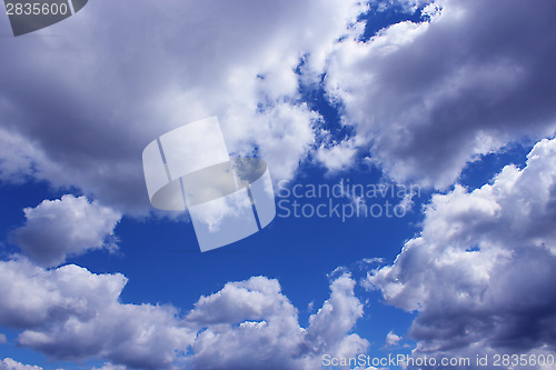 Image of picturesque white clouds on blue sky background