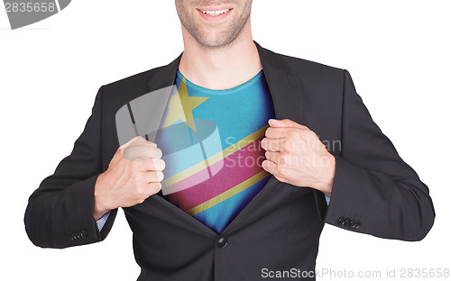 Image of Businessman opening suit to reveal shirt with flag