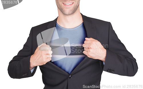 Image of Businessman opening suit to reveal shirt with flag