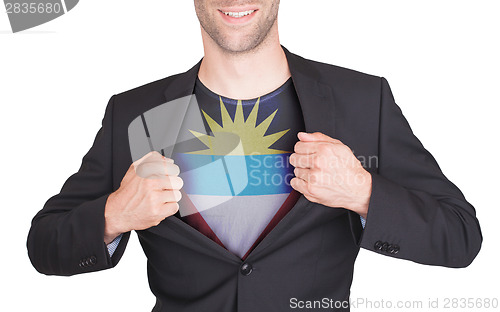 Image of Businessman opening suit to reveal shirt with flag