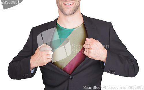 Image of Businessman opening suit to reveal shirt with flag