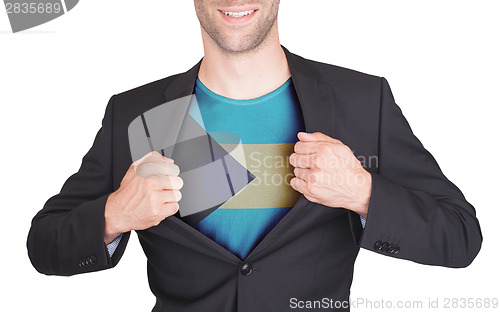 Image of Businessman opening suit to reveal shirt with flag