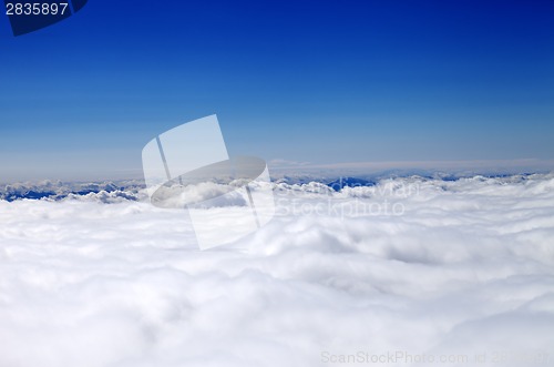 Image of Mountains in clouds at nice sun day