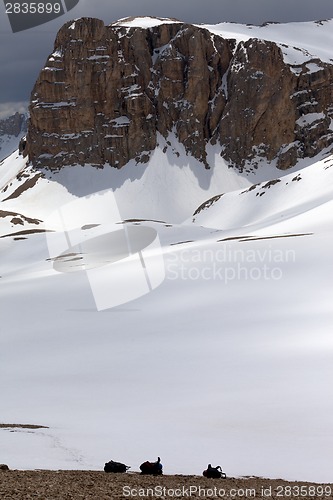Image of Snowy plateau and three backpack