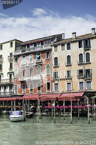 Image of Ancient buildings and boats in the channel in Venice