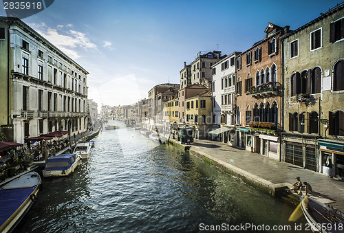 Image of Ancient buildings and boats in the channel in Venice