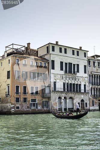 Image of Ancient buildings and boats in the channel in Venice