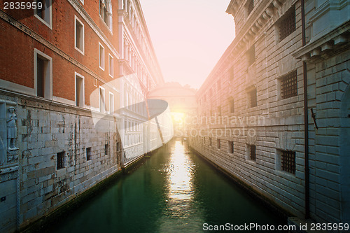 Image of Ancient buildings and boats in the channel in Venice