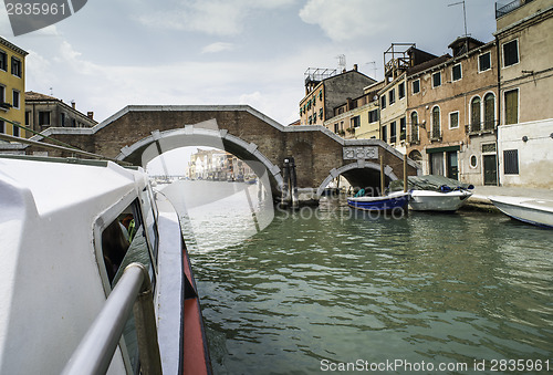 Image of Ancient buildings and boats in the channel in Venice