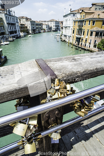 Image of Padlocks of lovers placed on the bridge