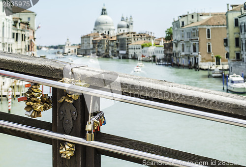 Image of Padlocks of lovers placed on the bridge