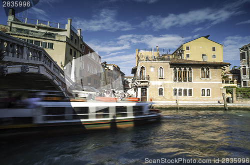 Image of Ancient buildings and boats in the channel in Venice