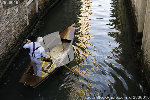 Image of Man on a boat in Venice