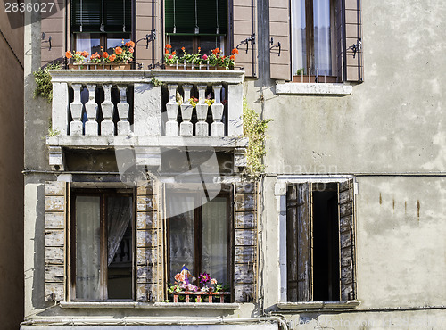 Image of Venetian windows with flowers