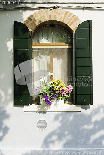 Image of Venetian windows with flowers