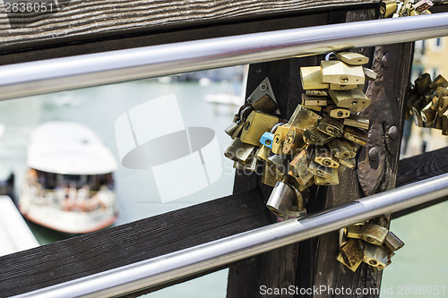 Image of Padlocks of lovers placed on the bridge