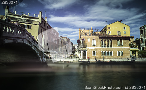 Image of Ancient buildings and boats in the channel in Venice