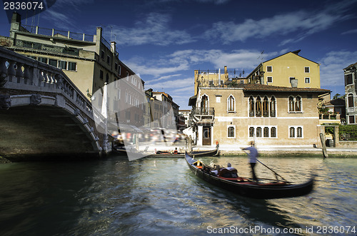 Image of Ancient buildings and boats in the channel in Venice