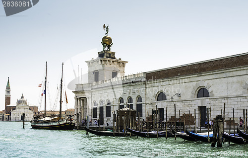 Image of Ancient buildings and boats in the channel in Venice