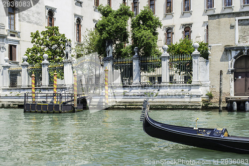 Image of Ancient buildings and boats in the channel in Venice