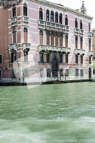 Image of Ancient buildings and boats in the channel in Venice