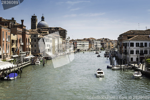 Image of Ancient buildings and boats in the channel in Venice