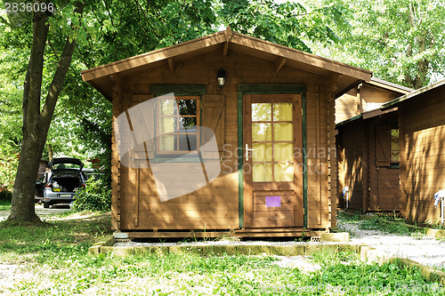 Image of Wooden bungalows on campsite camping