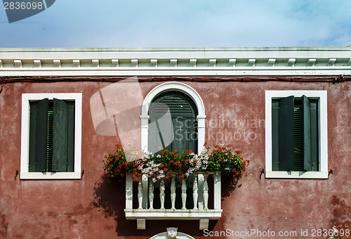 Image of Venetian windows with flowers