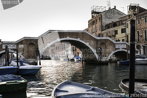 Image of Ancient buildings and boats in the channel in Venice