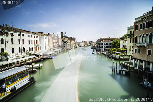 Image of Ancient buildings and boats in the channel in Venice