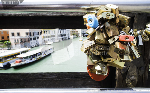 Image of Padlocks of lovers placed on the bridge