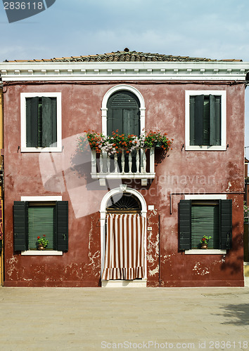 Image of Bright red color house in Venice