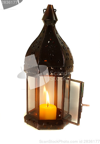 Image of Lamp with lighted candle