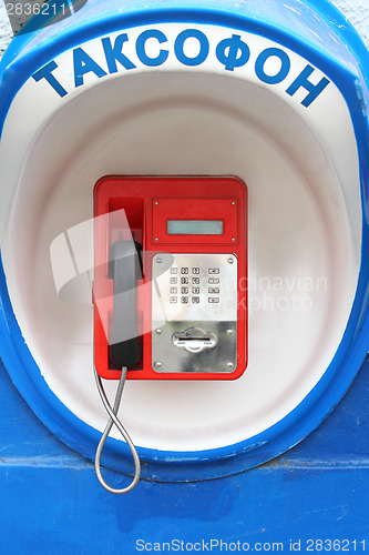 Image of Red pay-phone on wall