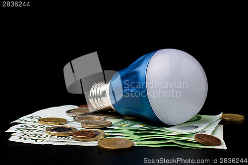 Image of LED Bulb with money