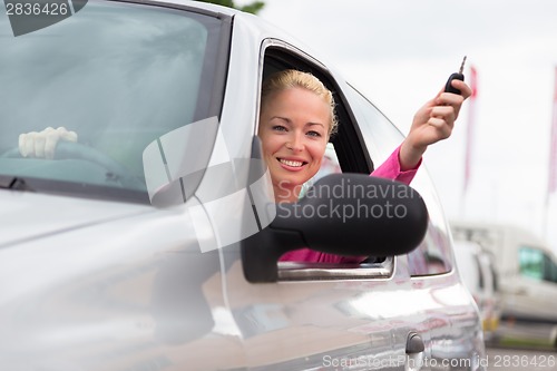 Image of Woman driver showing car keys.